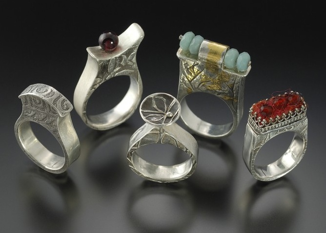 Rings by Lora Hart. Fine silver with gold accents, beads, and felt.